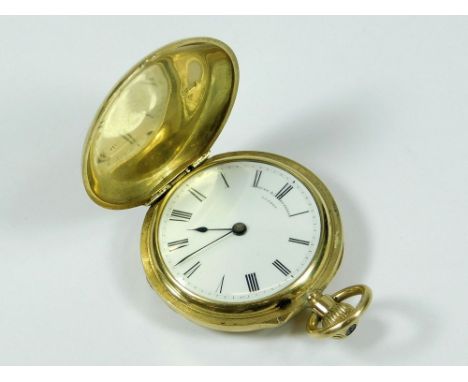 GOLD POCKET WATCH. An 18ct. gold full hunter small pocket watch, retailed by Hunt & Roskell, London. The case monogrammed wit