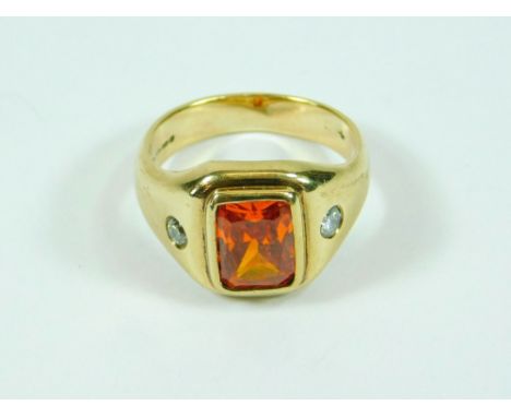 FIRE OPAL. A bespoke 9ct. gold ring set a rectangular fire opal of approx. 4ct., & each shoulder set a brilliant cut diamond.