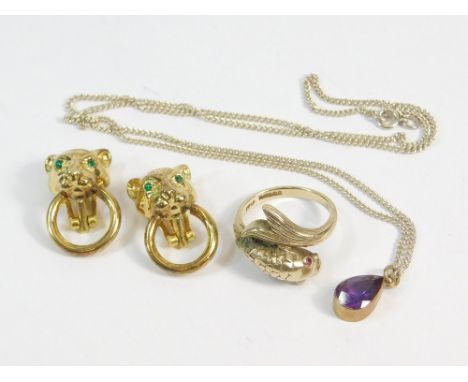 GOLD RING ETC. A 9ct. gold 'fish' ring set with ruby eyes. Size K. Also, a 9ct. gold mounted amethyst pendant on sterling sil