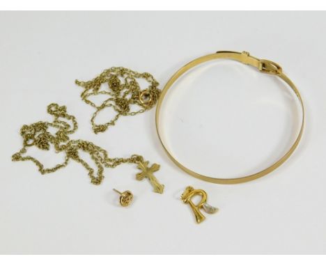 GOLD BANGLE ETC. A 9ct. gold bangle with 'buckle' fastener. Also, a 9ct. gold cross with chain & a little scrap gold etc. (GA