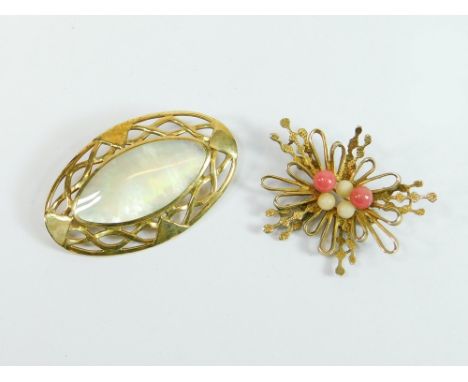 GOLD BROOCHES. A 9ct. gold oval brooch set with mother of pearl, width 5cm. Also, one other 9ct. gold brooch set with semi-pr