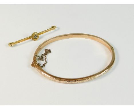 BANGLE & PIN. A Victorian, 9ct. rose gold hinged bangle & a 9ct. gold diamond set stock pin. Approx. 6.1g.  Please note that 