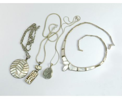 SILVER PENDANTS ETC. Three silver mounted pendants set with mother of pearl, haematite etc. Also, a silver & mother of pearl 