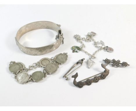 SILVER BRACELETS ETC. A 1960's heavy engraved silver hinged bangle with personalised inscription. Also, a silver Viking boat 