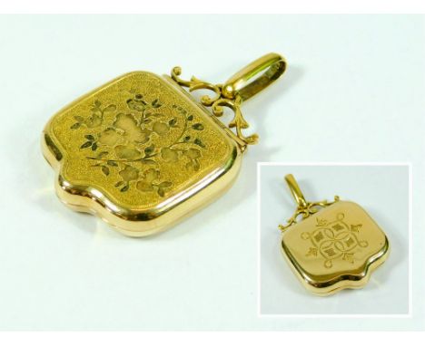 GOLD LOCKET. An 18ct. gold shaped locket with plain suspension loop, c.1869. (enamel from decorated front missing). To the re