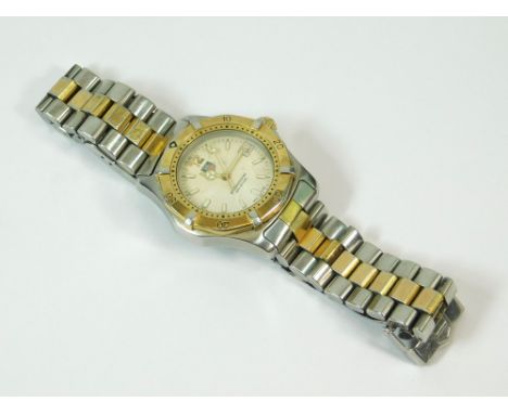 TAG HEUER. A gentleman's stainless steel Tag Heuer bi-coloured wristwatch with bracelet strap. The dial with luminescent bato