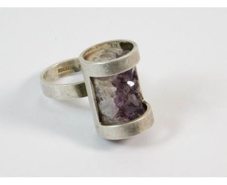 MAGNUS MAXIMUS. A Magnus Maximus Designs of Frizington, Cumbria, silver ring set with amethyst quartz. Stamped with maker's m