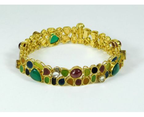 ENAMELLED BRACELET. A yellow metal flexible bracelet, the various sections filled with enamel & a variety of coloured stones.