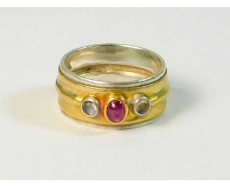 ALEX EVERITT. A bespoke ring by Alex Everitt with two colour shank & set a cabochon ruby & two moonstones. Stamped maker's ma