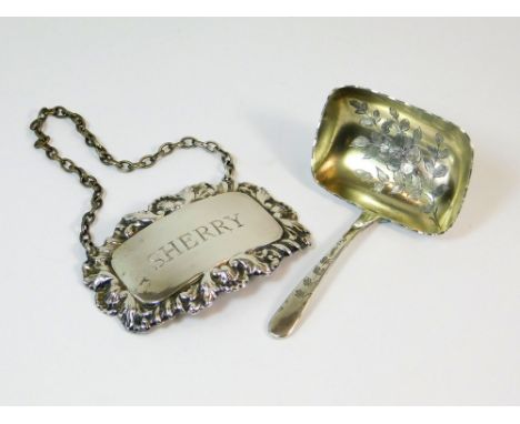 CADDY SPOON ETC. A late Victorian caddy spoon with floral engraved bowl. London 1897. Also, a modern silver spirit label, She