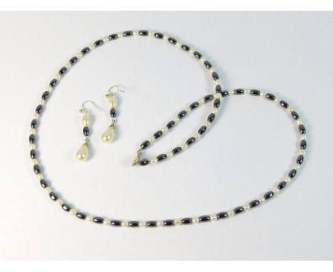HAEMATITE & PEARL. A haematite & cultured pearl necklace with matching drop earrings. Necklace length 64cm.  Please note that