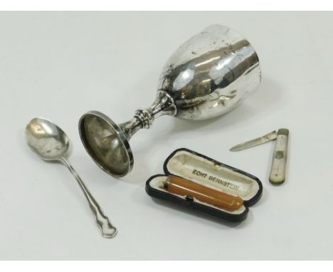 SILVER CUP ETC. A small silver goblet, 12cm. Also, a mother of pearl fruit knife with silver blade (split), a cased cigarette