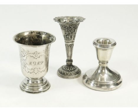 CANDLESTICK ETC. A modern single low silver candlestick, height 7.5cm. Also, a silver coloured metal pedestal beaker (apparen