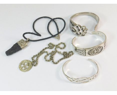 CELTIC STYLE JEWELLERY. A large Celtic style bracelet, a gentleman's silver mounted Celtic style pendant on cord, a Celtic cr