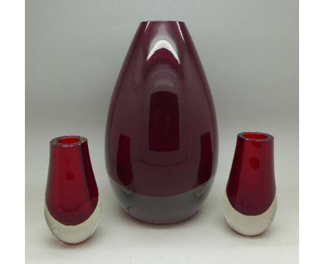 Two Whitefriars glass cased ruby red vases and a larger ruby glass vase