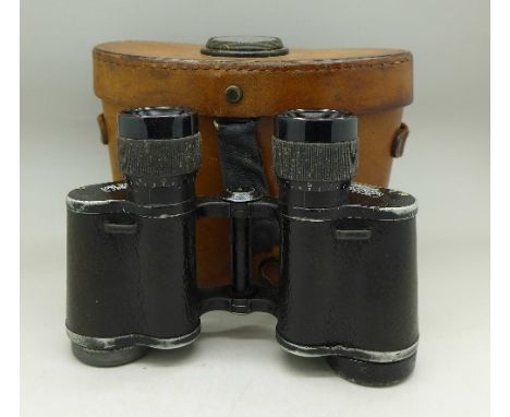 A pair of Carl Zeiss Jena, Deltrentis 8x30 binoculars, with leather case, top of case with compass marked Bausch & Lomb, Roch