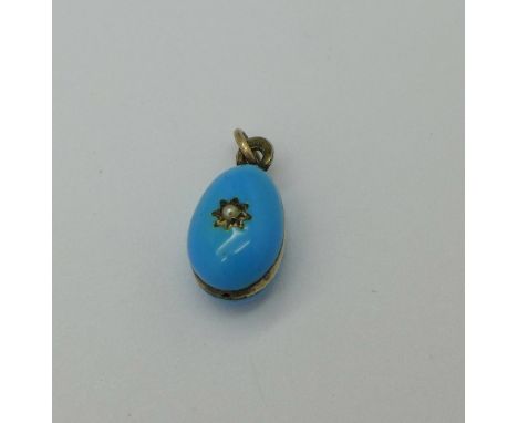 A Russian silver enamel egg pendant marked '84' and with initials XB