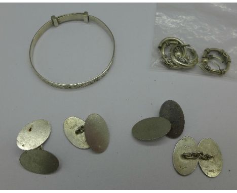 Two pairs of silver cufflinks, silver earrings and a bangle