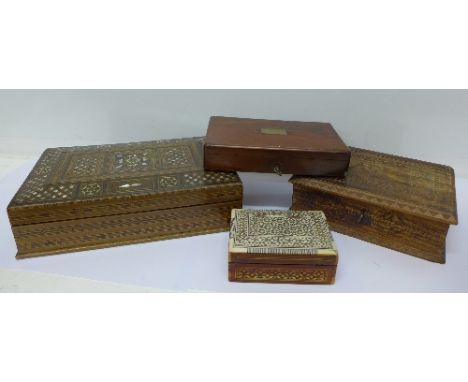 A carved box dated 1899, a small inlaid box, a mother of pearl inlaid box and a mahogany box (4)