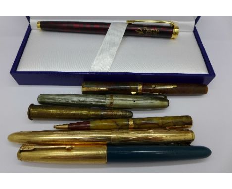 A Waterman pen, boxed, two gold plated Parker pens, two Waterman pens with 14k nibs, a bullet pencil and one other pencil