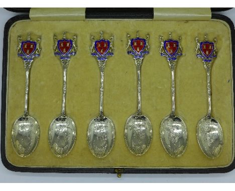 A cased set of six Walker and Hall silver and enamel spoons with crests, inscribed Newcastle and District M.C.