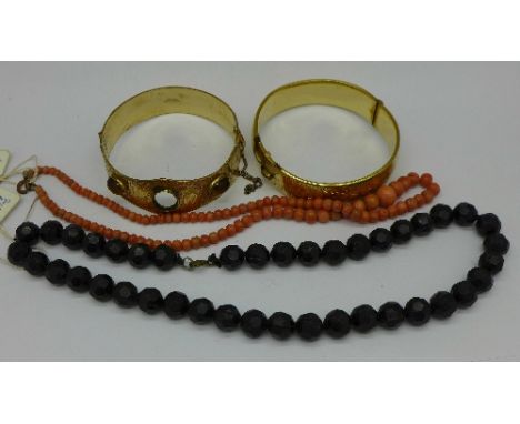 A coral necklet, a bead necklace, a 1/5th rolled 9ct gold bangle and a 1/20th rolled 12ct gold bangle, a/f