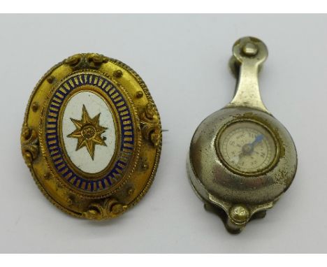 A Victorian gilt metal pendant, lacking stone, and a compass magnifying glass