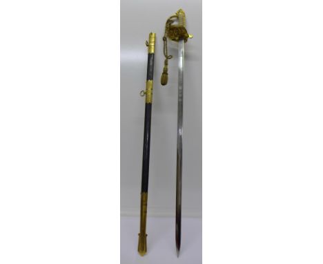 A Queen Elizabeth II Naval Officers sword with scabbard, the blade marked Wilkinson