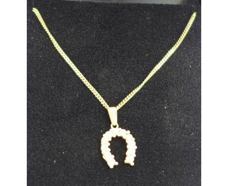 A 9ct gold and pearl set horseshoe pendant on 9ct gold chain, 3.8g