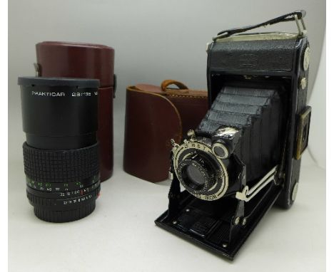 A Zeiss Ikon camera with case and a Praktica 2.8/135MC lens, with case