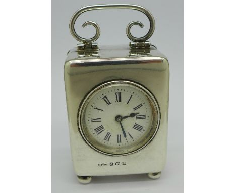 A silver cased carriage clock, Henry Clifford Davis, Birmingham 1907, French movement, the case on bun feet