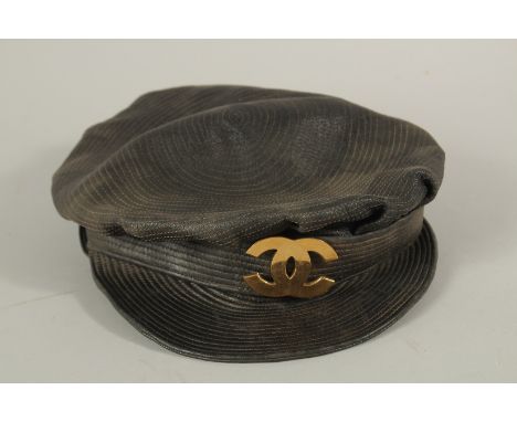 A CHANEL VINTAGE LEATHER AND CLOTH NEWS BOY HAT. Signed 56.