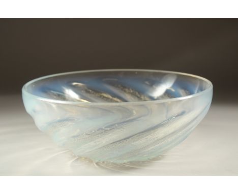 A LALIQUE CIRCULAR BOWL with spiral of fishes. 9.5cms diameter. Etched: R. Lalique, France.