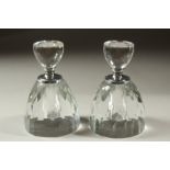 A PAIR OF CUT GLASS CIRCULAR PERFUME BOTTLES AND STOPPERS. 13cms high.