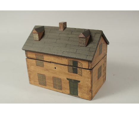 A WOODEN REPLICA HOUSE TEA CADDY. 24cms long.
