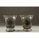 A PAIR OF GLASS VASES WITH COACHING SCENES. 6.5cms high.