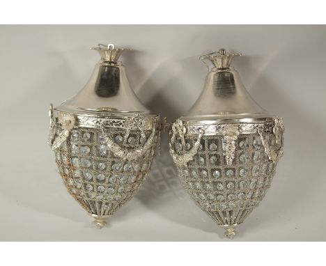 A PAIR OF SILVER PLATE ACORN LIGHT FITTINGS. 40cms long.
