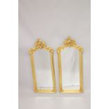 A PAIR OF GILTWOOD LONG MIRRORS. 3ft 8ins long x 1ft 7ins wide.