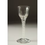A GEORGIAN WINE GLASS with white opaque stem. 5.5ins high.