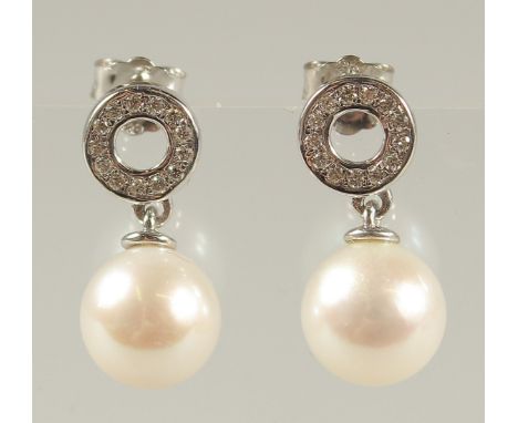 A PAIR OF 9CT WHITE GOLD CULTURED PEARL DROPLET EARRINGS with diamond halos. R/C diamonds 0.15ct, boxed.