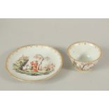 A GOOD TEA BOWL AND SAUCER, WELL PAINTED WITH CHINESE FIGURES in a landscape to both tea bowl and
