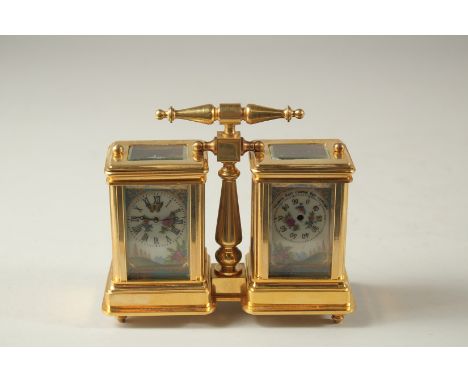 A SEVRES MODEL DOUBLE CARRIAGE CLOCK with porcelain panels and carrying handles. 10cms high.