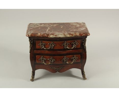 A LOUIS XVTH STYLE APPRENTICE COMMODE with marble top, two long drawers with ornate handles, on curving feet. 13ins long x 12