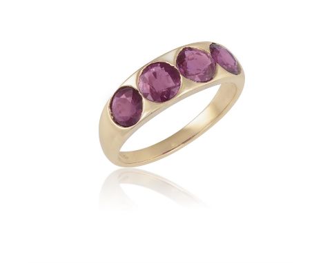 A RUBY FOUR-STONE RINGThe frontispiece set with four collet-set circular-cut rubies, to a plain hoop, mounted in 18K rose gol