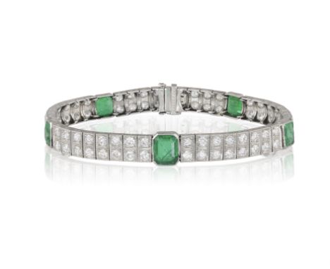 AN EARLY 20TH CENTURY EMERALD AND DIAMOND BRACELETComposed of five collet-set rectangular-cut emerald between a double row of