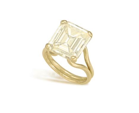 A SAPPHIRE DRESS RINGThe rectangular cut-cornered yellow sapphire weighing 14.80cts within a four-claw setting, to bifurcated