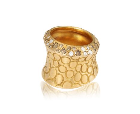 A DIAMOND 'COCCO' DRESS RING, BY POMELLATODesigned as a textured concave band, ingraved with circular motifs, accented by bri