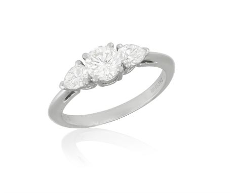 A DIAMOND THREE-STONE RING, BY TIFFANY & CO.The central brilliant-cut diamond weighing 0.51ct within a four-claw setting, bet