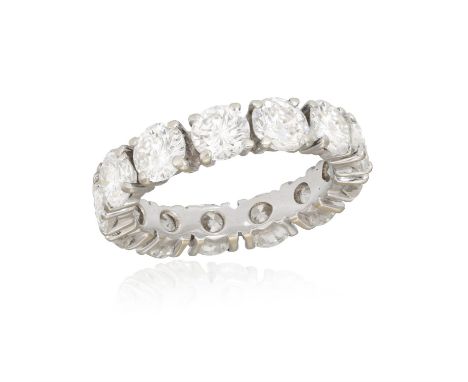 AN IMPORTANT DIAMOND ETERNITY RINGComposed of a continuous row of brilliant-cut diamonds within claw setting, mounted in gold