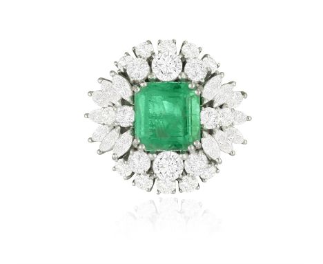 AN EMERALD AND DIAMOND DRESS RING, CIRCA 1960The central cut-cornered square emerald weighing 4.16cts within a double four-cl